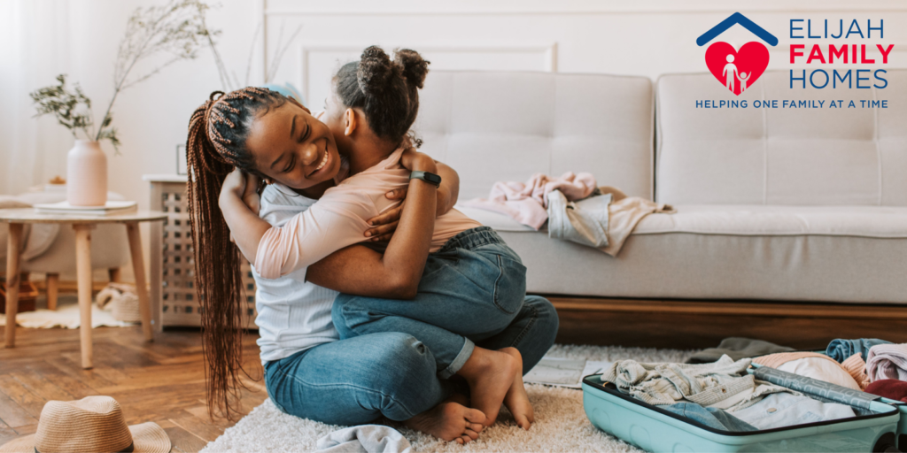 Mother hugging her young daughter in a safe home, representing hope, recovery, and family reunification